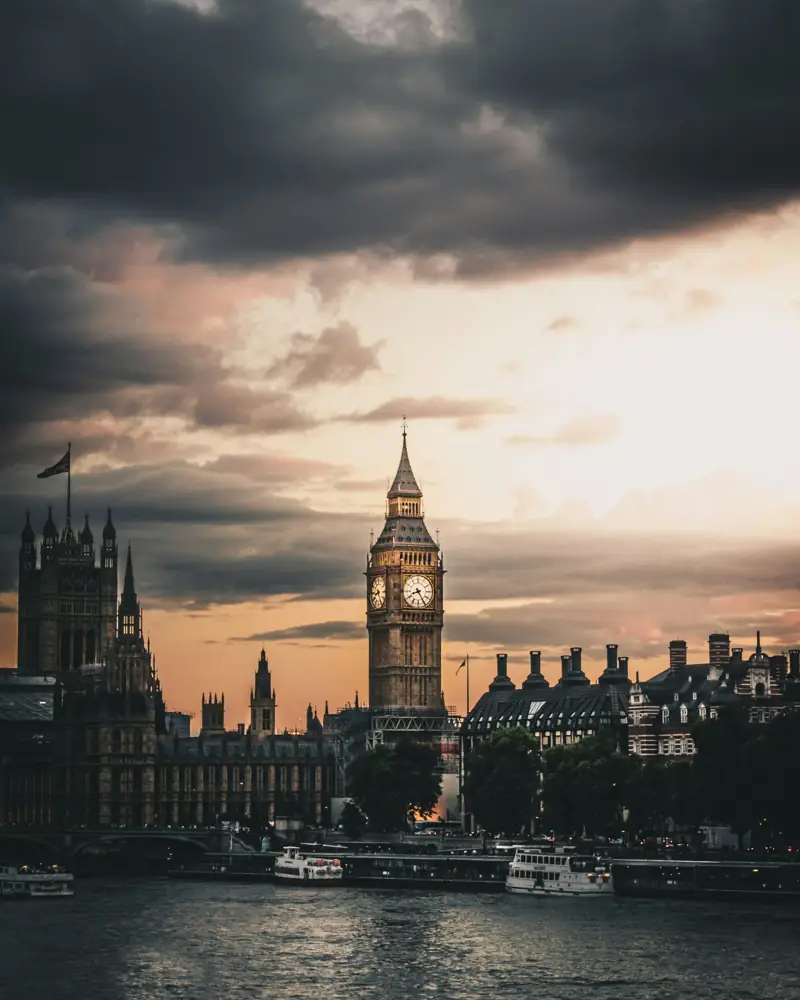 Elizabeth Tower and the Houses of Parliament across the Thames under an evening sky