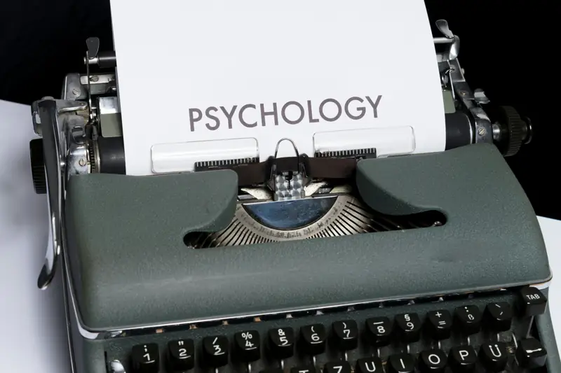 A typewriter with the word Psychology typed on the page
